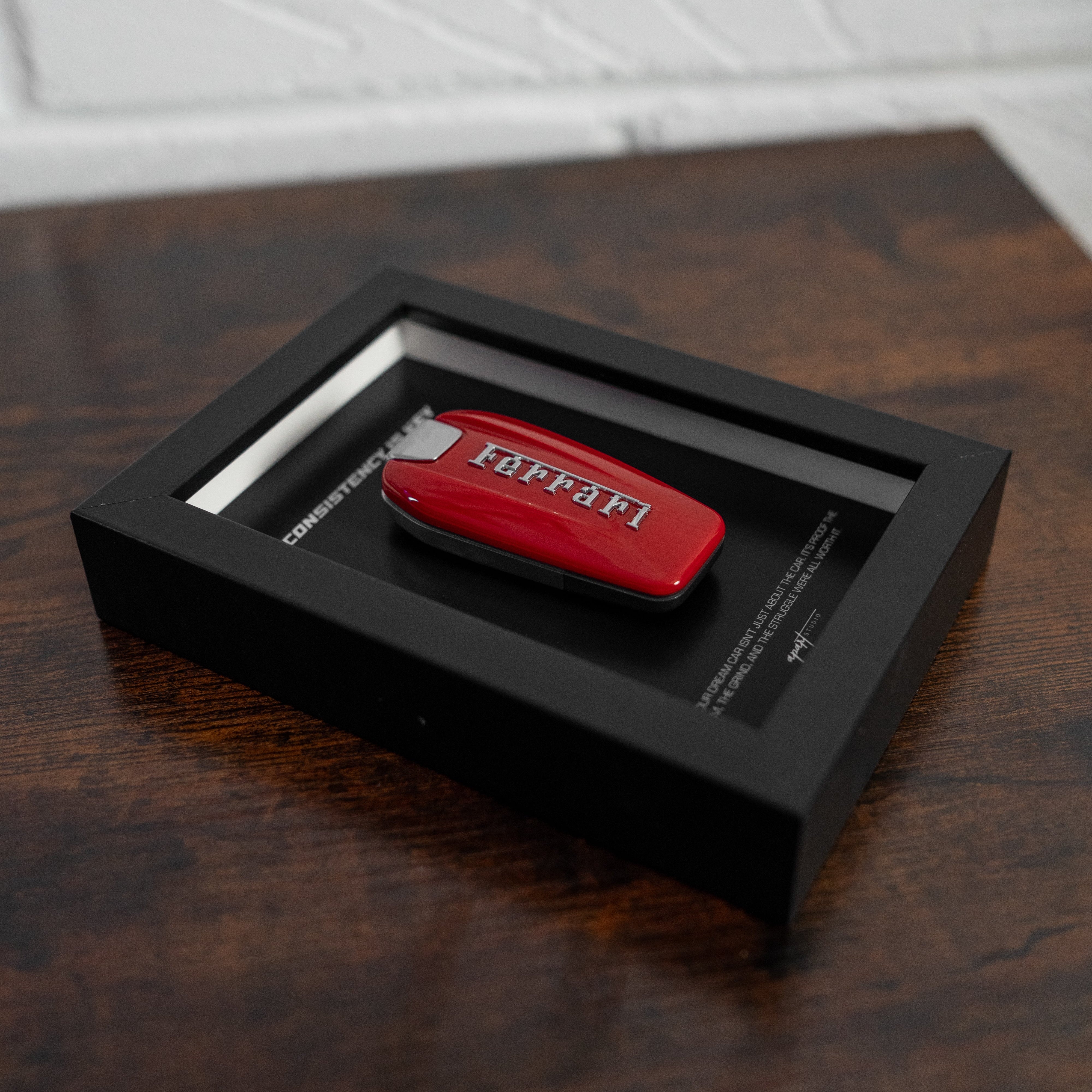 Consistency is Key Ferrari lifestyle wall display, motivational Ferrari artwork mounted in home setting by Apart Studio
