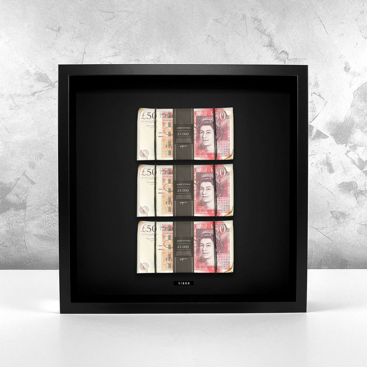 Aged Triple Stacked Frame GBP mounted on a textured wall, three stacks of British pounds displayed as luxury wall art by Apart Studio