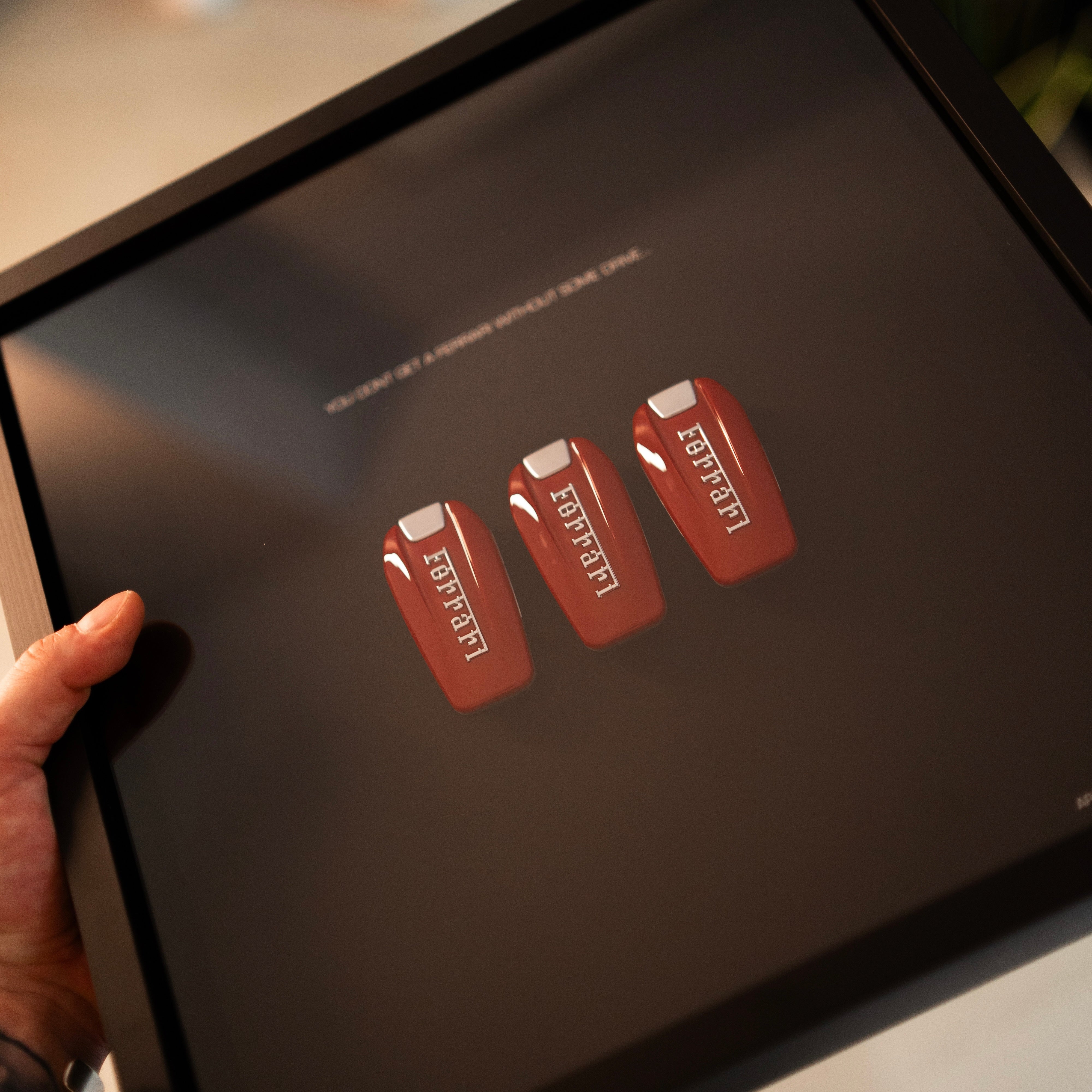 The Drive Frame Ferrari alternate angle showing Ferrari key and badge artwork construction in deep frame