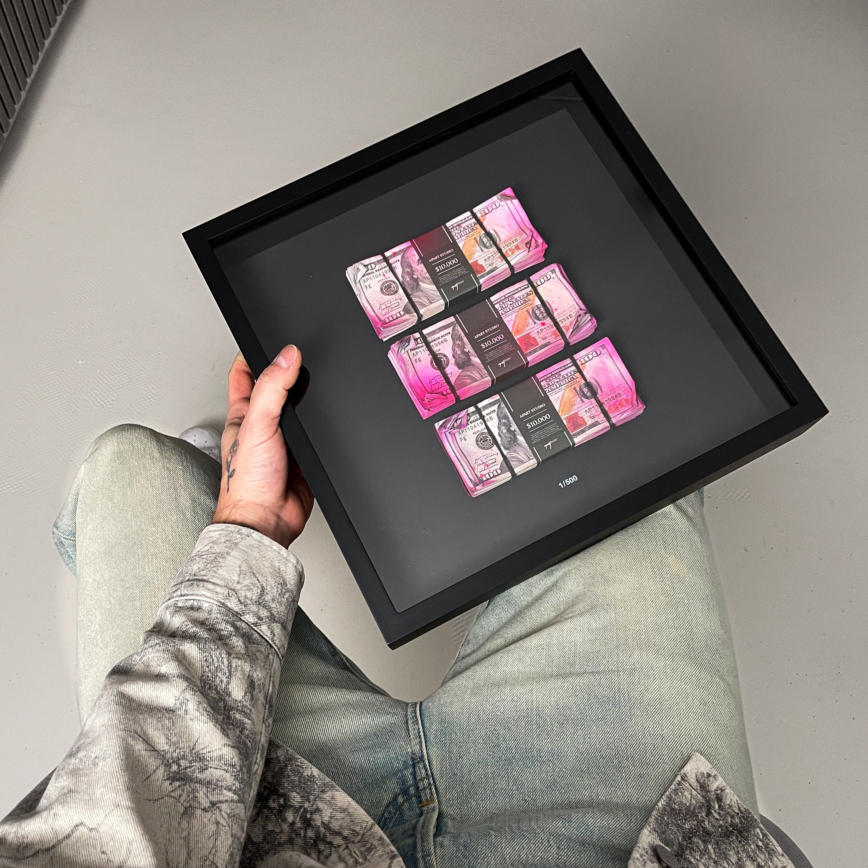 Bank Heist Frame USD angled view showing depth and 3D construction of dollar bill artwork behind glass