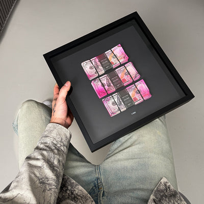 Bank Heist Frame USD angled view showing depth and 3D construction of dollar bill artwork behind glass