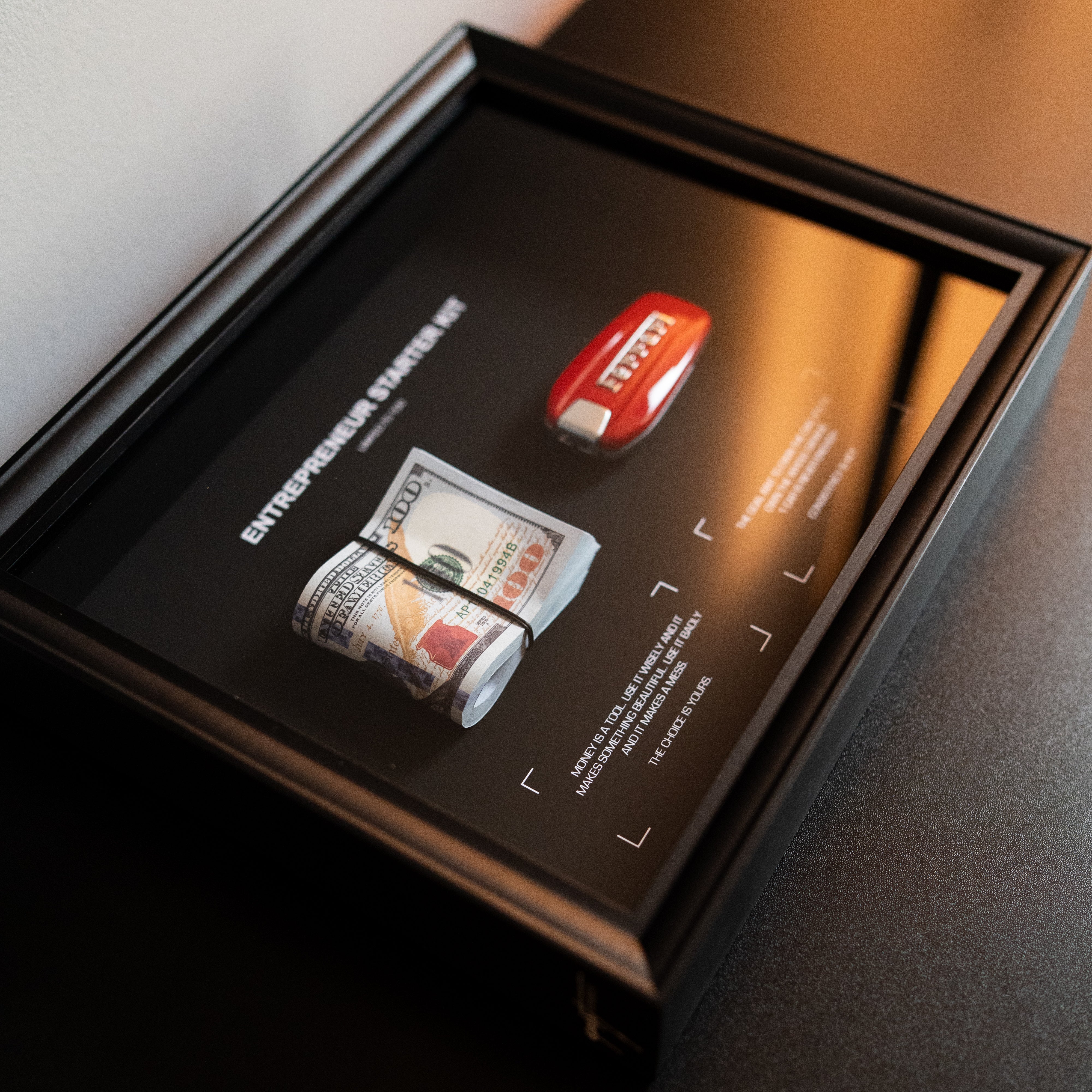 Entrepreneur Starter Kit Ferrari close up of framed artwork detail with Ferrari themed elements