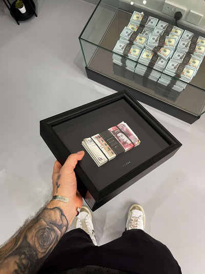 Aged Stacked Frame GBP held in hand showing the aged British fifty pound notes wrapped in a custom satin band