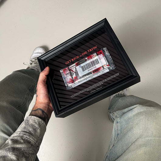Get Rich or Die Tryin Frame held in hand showing the handmade 3D constructed money artwork