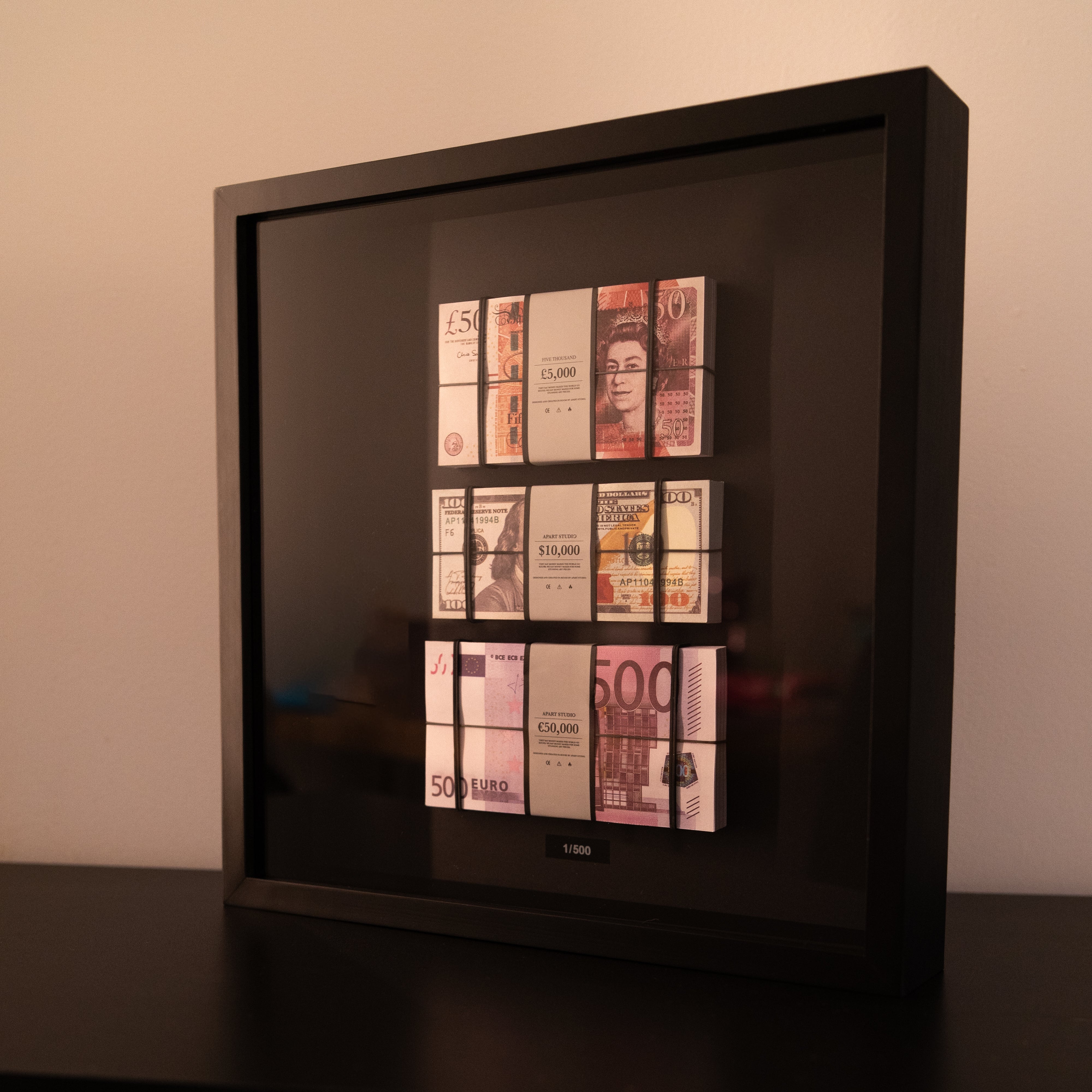Foreign Exchange Frame angled view showing depth of frame with three world currency cash stacks by Apart Studio