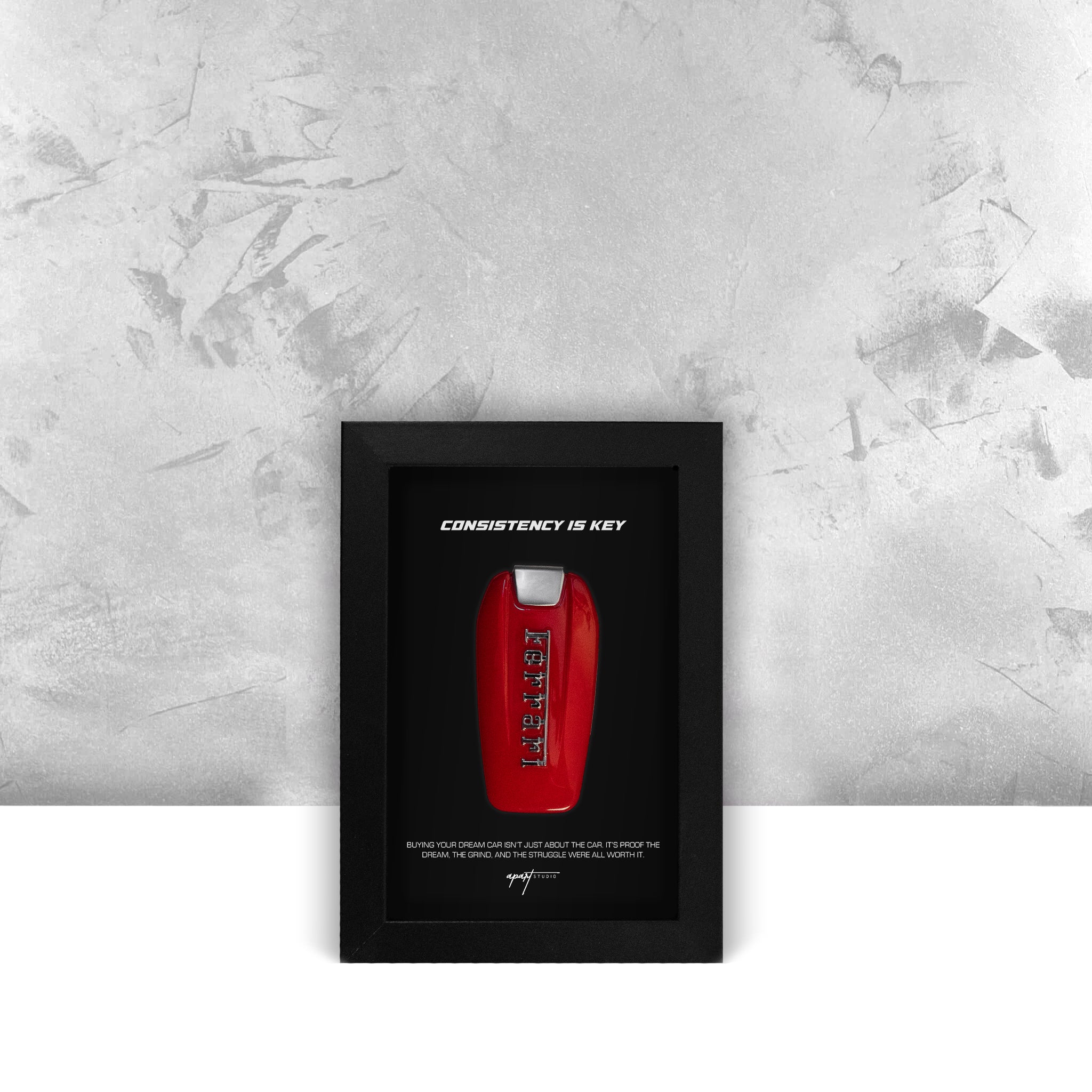 Consistency is Key Ferrari front view, Prancing Horse badge with motivational text in handmade black frame by Apart Studio