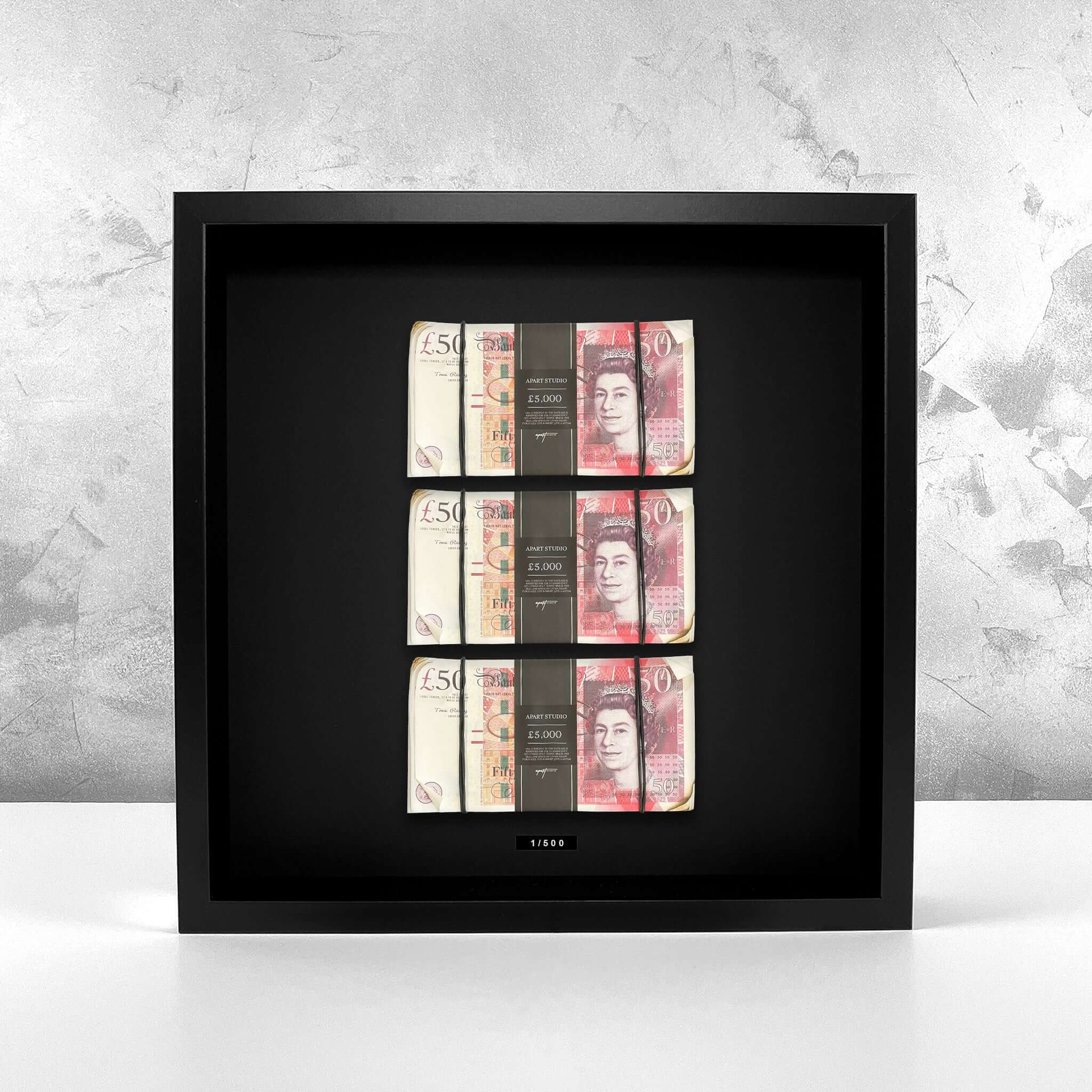 Aged Triple Stacked Frame GBP mounted on a textured wall, three stacks of British pounds displayed as luxury wall art by Apart Studio